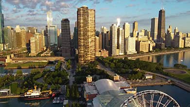 Aerial with morning light over beautiful Navy Pier and Chicago skyline on Lake Michigan