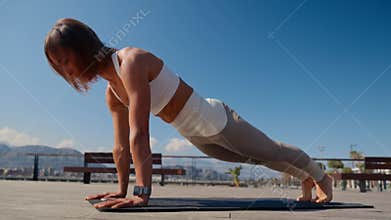 Caucasian beautiful woman doing yoga in the park. Be H3althy