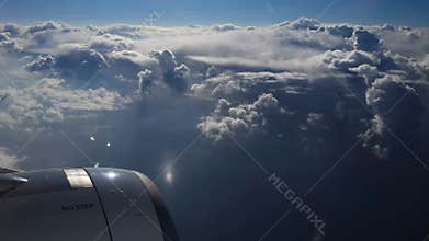 Breathtaking view from plane's illuminator during morning flight. 4K video