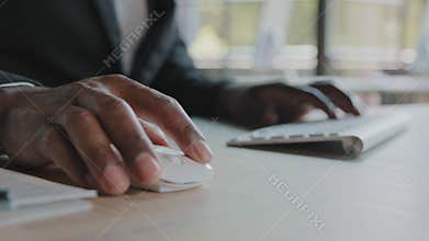 Close up unknown african american programmer businessman web designer work in IT company typing on modern keyboard use