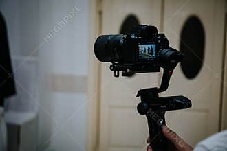 Cameraman shooting a wedding ceremony with a video camera
