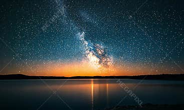 Celestial Sunset over a Serene Lake