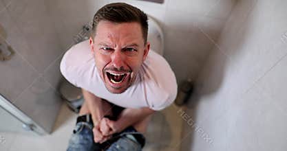 Man screams of intense digestive discomfort on toilet bowl