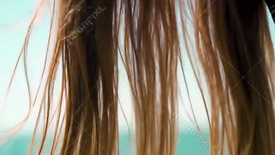 Wet Hair Blowing in the Wind by the Sea