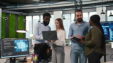 Portrait of teamworking programmers in office developing apps using AI