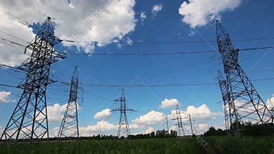 tall electric masts against cloudy sky - timelapse