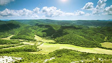 Wide Angle view green valley timelapse clouds