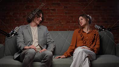 Engaging Conversation Between Influencers in a Creative Podcast Studio Setting