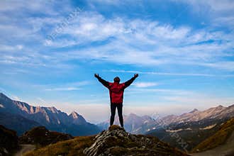 Women silhouette on the top of mountain