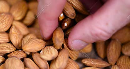 ready-to-eat almond nuts on a wooden table