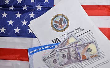 United States Department of Veteran affairs document with social security card and Dollars, American flag in the backdrop. SSN,