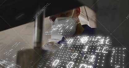 Technician sliding workpiece under hydraulic press, initiating tech binary code calibration overlay