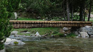 Wooden Bridge-trail over Mountain Riwer.