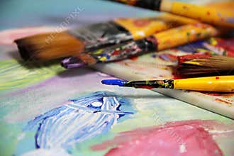 Art palette, picture and mix of paintbrushes