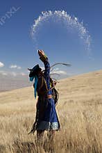 Mongolian shaman, in an offering ceremony