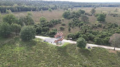 Erial view of a unique wooden structure nestled in the lush greenery of Venekotensee, Germany