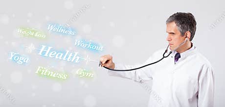 Clinical doctor pointing to health and fitness collection of words