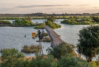A constructed causeway connects the land to islands in the Murray River.
