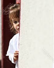 Shy young child hiding