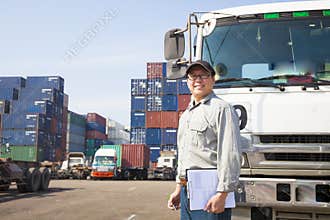 driver in front of container truck