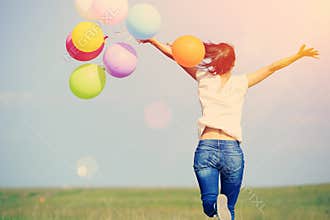 Young asian woman with colored balloons