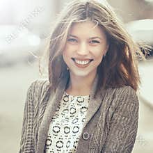 Beautiful happy smiling girl outdoors. Woman smiling joyful, fri