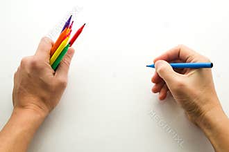 The man's hand, ready to draw a picture