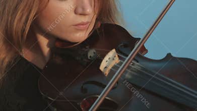 Girl emotionally plays the violin