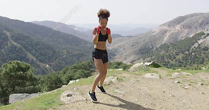 Fit boxing woman looking aggressive