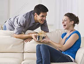 Woman laughing at gift