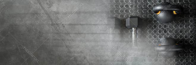 Kettlebells and dumbbells in Gym with dark transition