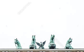 Brandeburg gate view of bronze horses from below on white background