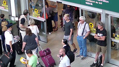 Top shot of people leaving airport terminal of international arrival lobby