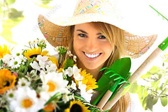 Blond girl and gardening tools