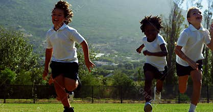 Children running in park during race