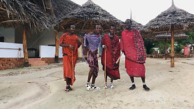 The Masai tribe dances national dance at sunset and bids farewell to the sun. 4K