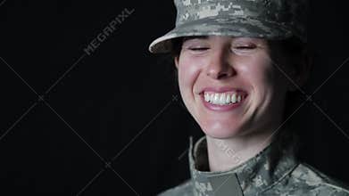 Female soldier laughs