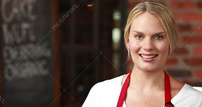 Smiling waitress winking at the camera