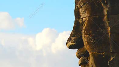Zoom Out of Stone Carving of Buddha's Face on Temple Wall - Angkor Wat Temple Cambodia
