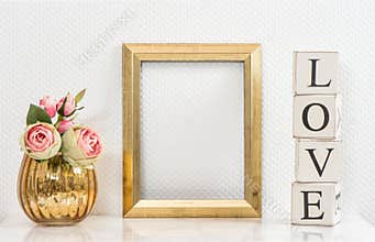 Mock up with golden frame and flowers. Love concept