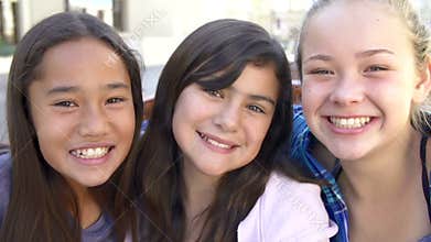 Three Teenage Girls Posing For Camera In Slow Motion