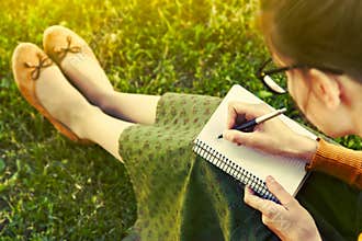 Girl with pen writing