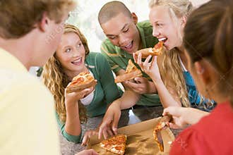 Group Of Teenagers Eating Pizza