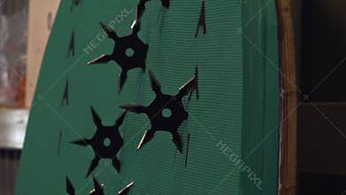 Ninja stars throwing on a practicing board