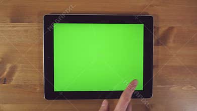 Man Using Tablet PC with Green Screen