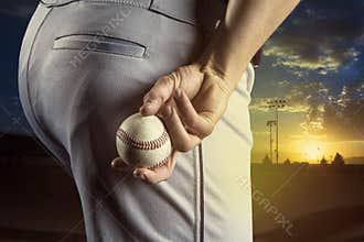 Baseball pitcher ready to pitch in an evening baseball game