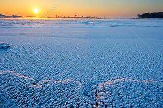 The snow and ice on the river sunrise