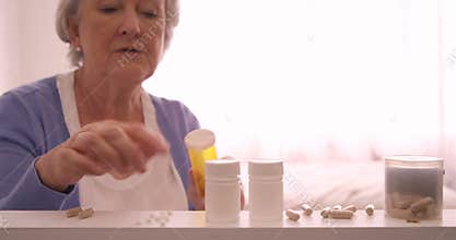 Senior woman arranging a pills