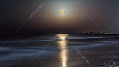 Full moon rise over sea. Moonlight timelapse