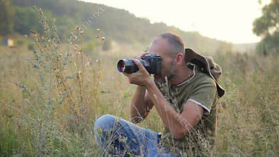 Photographer working outdoors.
